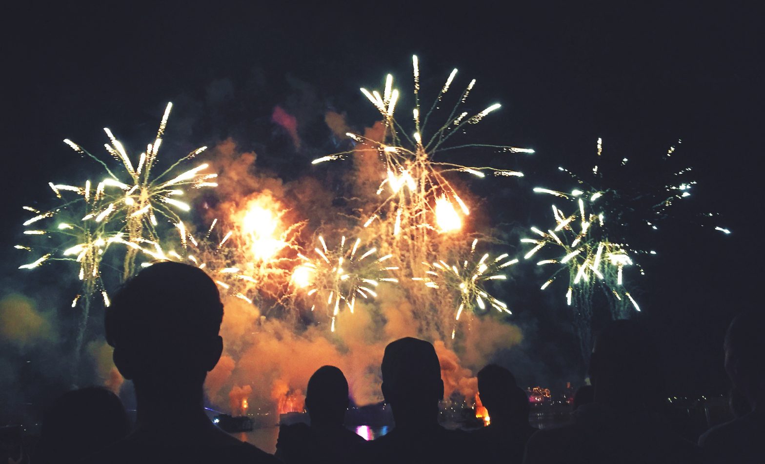 Silhouetted People Watching a Fireworks Display